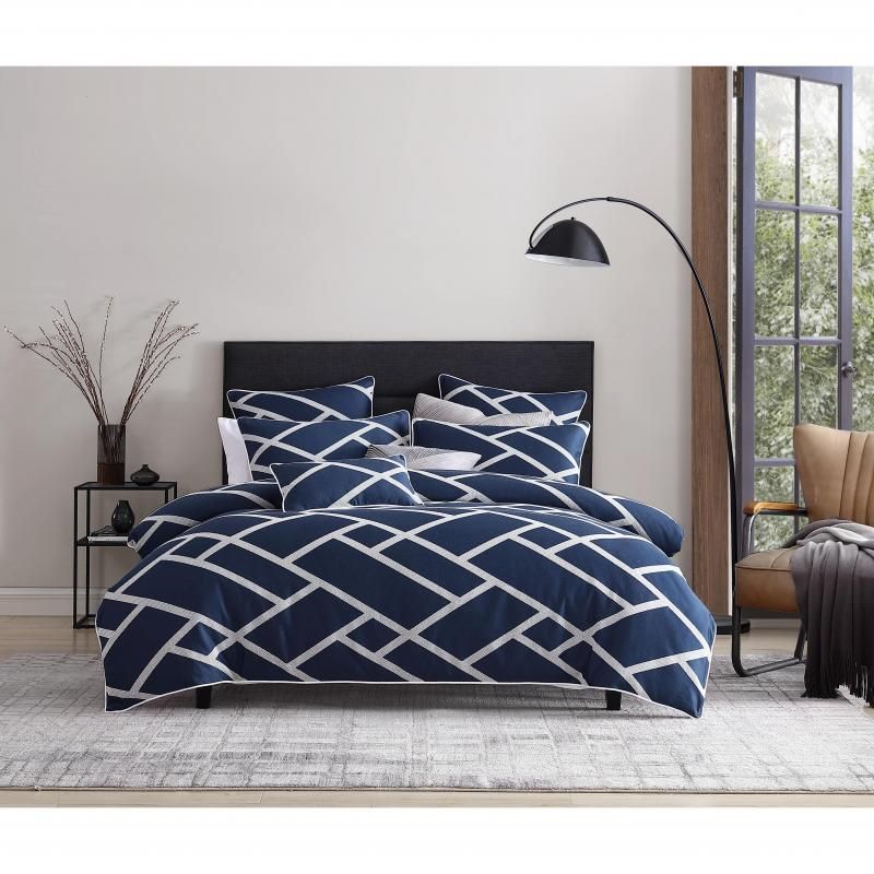 Luxurious navy jacquard quilt set for queen bed, includes quilt cover and two pillowcases, featuring silver and white accents.