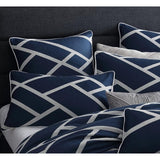 Luxurious navy jacquard quilt and pillowcase set for Queen bed, featuring elegant silver and white accents.