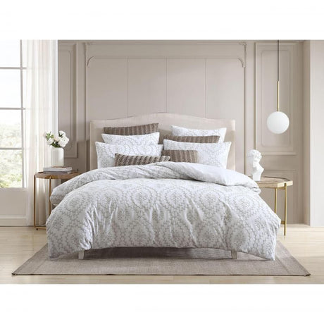 Elegant latte quilt and pillowcase set with intricate embroidery for a cozy queen bed. Durable cotton-polyester blend.