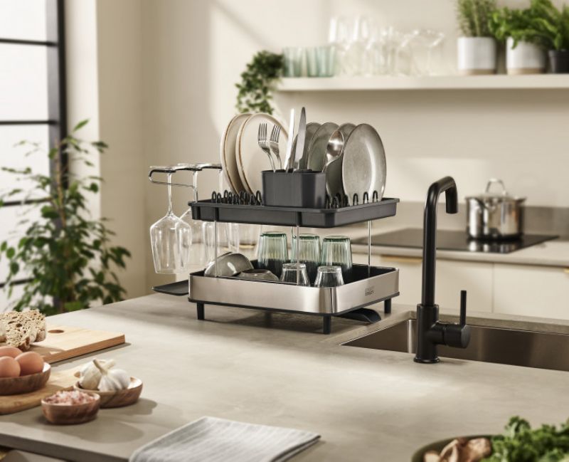 Joseph Joseph Steel 2-Tier Dish Rack with wine glass holder, adjustable cutlery holder, and integrated drainage spout.