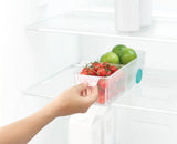 Joseph Joseph FridgeStore Small Storage: a compact fridge drawer with easy-pull handle, wheels, and removable divider for organized food storage.