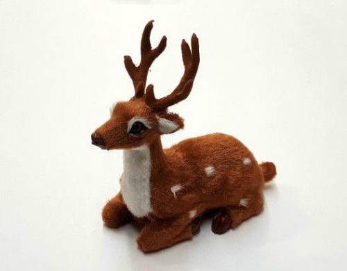 Delicate 'Resting Deer' ornament, featuring intricate designs, perfect for festive decor and nature lovers.