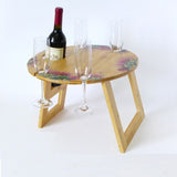 Eco-friendly Pohutukawa Bamboo Round Table, perfect for outdoor use, holding wine and glasses, lightweight at 0.6 kg.