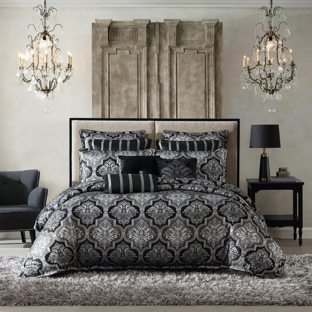 Elegant queen duvet cover set in Chamonix Silver featuring damask motifs, reversible pillowcases, and luxurious finishing touches.