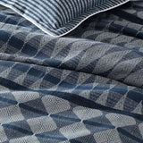 Queen duvet cover set in slate blue and silver grey with striped and geometric patterns, featuring concealed button closures.