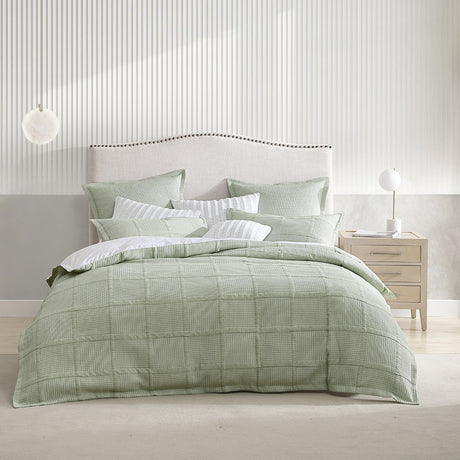 Luxurious king duvet cover set in sage green with a textured design, featuring concealed button closures and soft cotton-polyester blend.