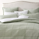 Luxurious King Duvet Cover Set in sage green with textured design, concealed button closures, and soft cotton-polyester blend.