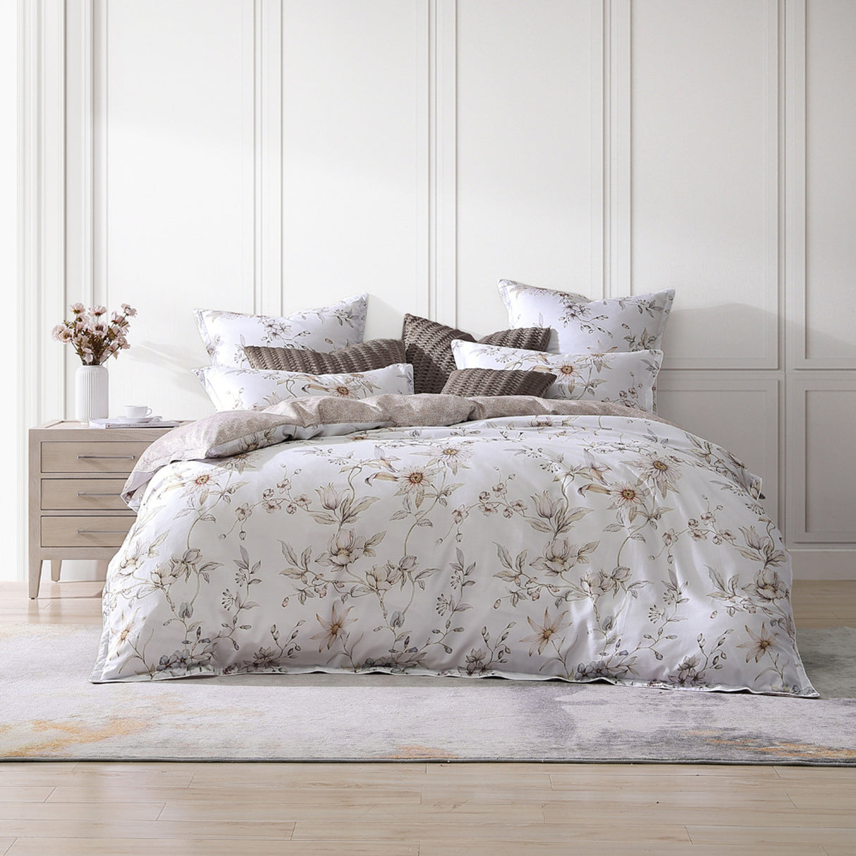 Delicate Charlotte Pastel Queen Duvet Cover Set in soft floral print with pink, lilac, and blue hues, featuring a linen fern reverse.