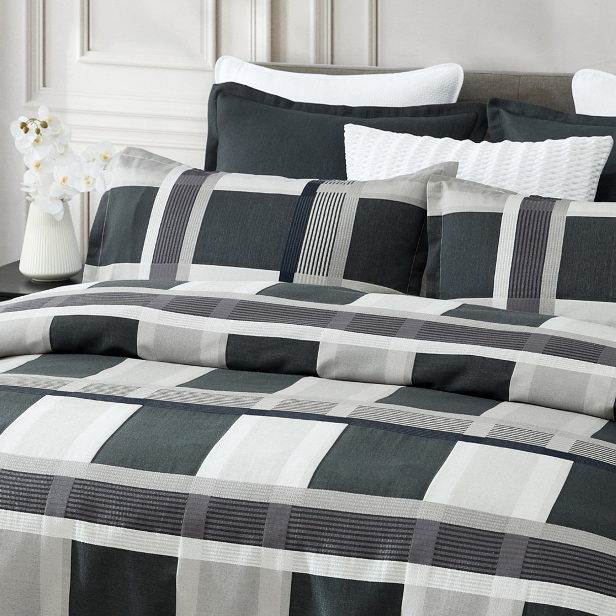 Queen duvet cover set in silver with bold check pattern, includes quilt cover and pillowcases, designed for modern elegance.