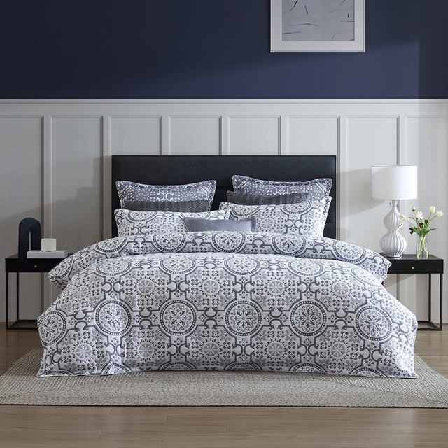 Queen Duvet Cover Set in Mayfair Navy featuring folk art motifs on a white background, quilted for comfort and style.