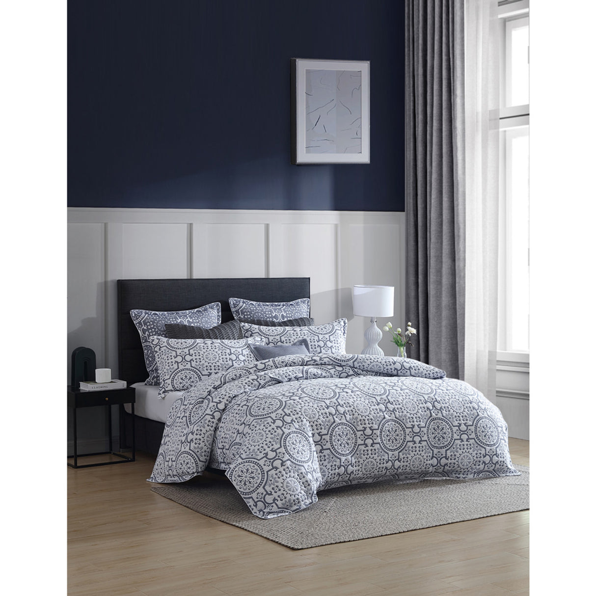 Queen Duvet Cover Set in Mayfair Navy, featuring folk art motifs on white, a quilted design, and versatile coverlet option.