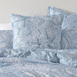 Elegant Laka Denim European pillowcase featuring a denim look and jungle foliage design in tonal blues, perfect for bedroom decor.