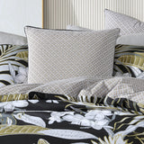 Luxurious Tariq Black European Pillowcase with a micro geometric pattern in beige/gold and black, featuring elegant black piping trim.