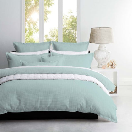 Single duvet cover set featuring textured waffle weave design, crafted from 65% polyester and 35% cotton for comfort.