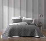 Luxurious Essex Charcoal quilted pillowcase sham pair with white bound edge, perfect for stylish and cozy bedding.