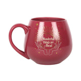 Whimsical pink mug that changes colors, revealing a crystal ball and hidden message when filled with hot beverages.