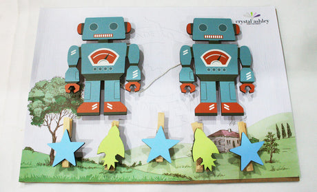 Whimsical robot wall art pegs for displaying children's artwork and photos, crafted from durable, eco-friendly MDF.