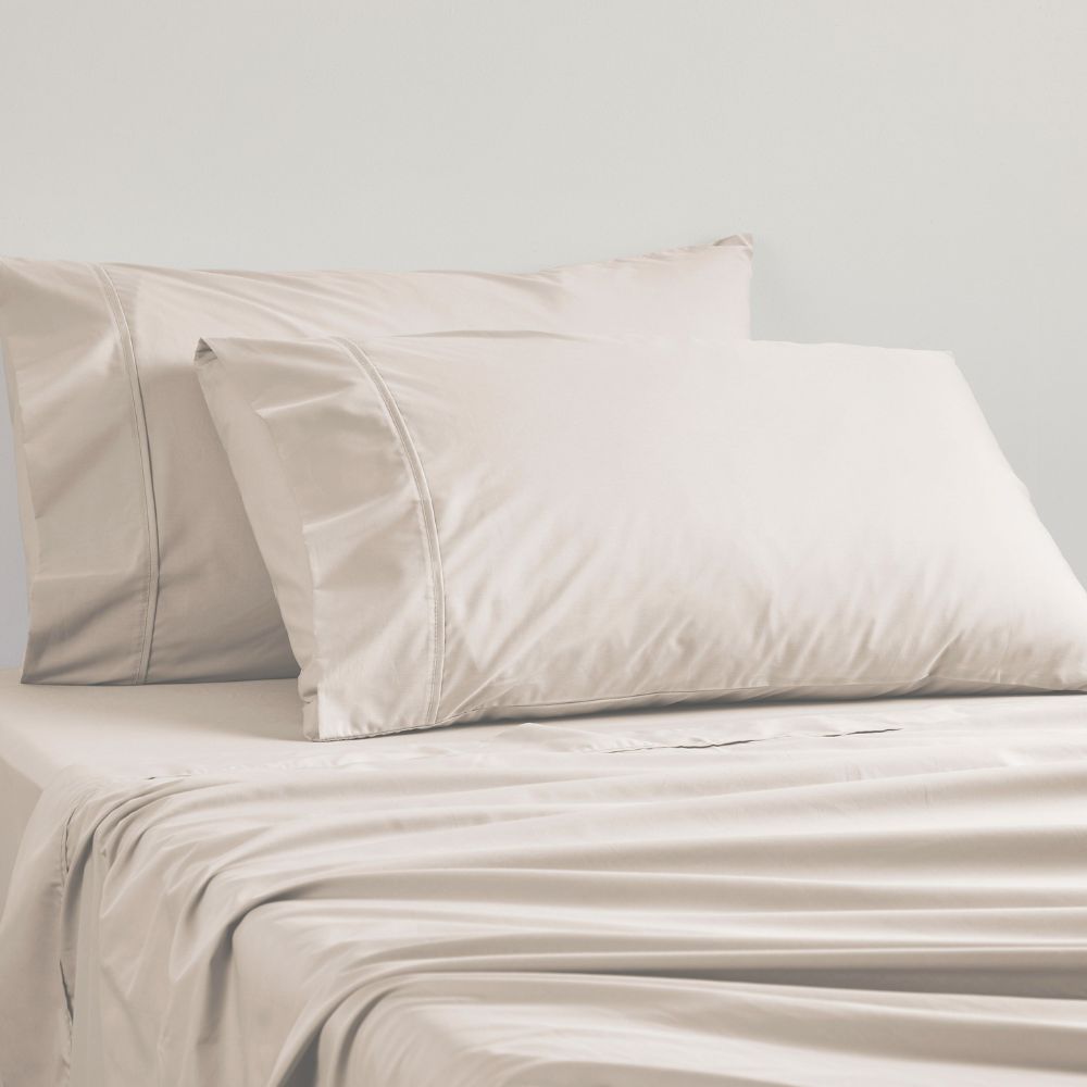 Logan and Mason king single sheet set in linen color, featuring soft percale weave and elegant piping details.