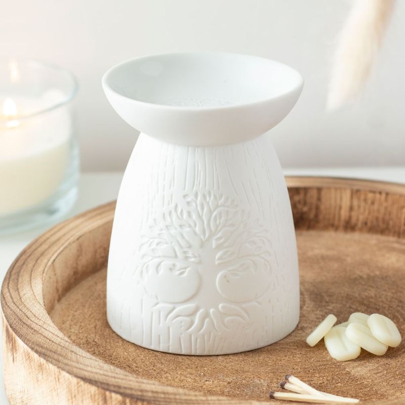 White ceramic oil burner featuring intricate Tree of Life design, perfect for enhancing ambiance with soothing fragrances.