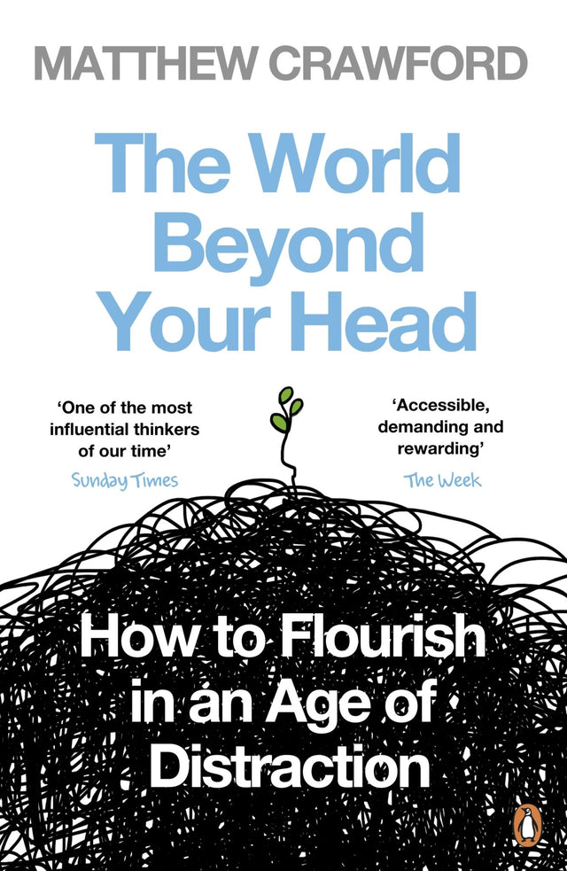 A paperback book titled "The World Beyond Your Head" by Matthew Crawford, exploring focus and mindfulness amidst distractions.