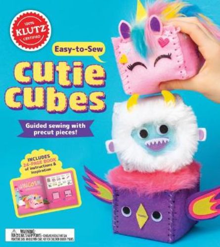 Colorful Easy-to-Sew Cutie Cubes kit for kids, featuring pre-cut felt pieces to create a yeti, unicorn, and dragon.