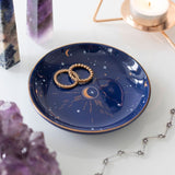 Ceramic blue crescent moon trinket dish with stars, perfect for holding jewelry and enhancing celestial-themed decor.