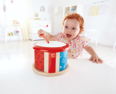 Hape Double-Sided Drum for toddlers, featuring two surfaces for rhythmic play, enhancing creativity and motor skills.