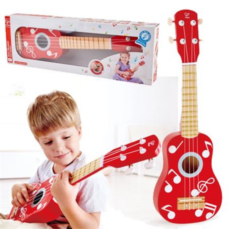 Bright red Hape Ukulele for kids, featuring four tunable strings and a scaled-down body, perfect for early music education.