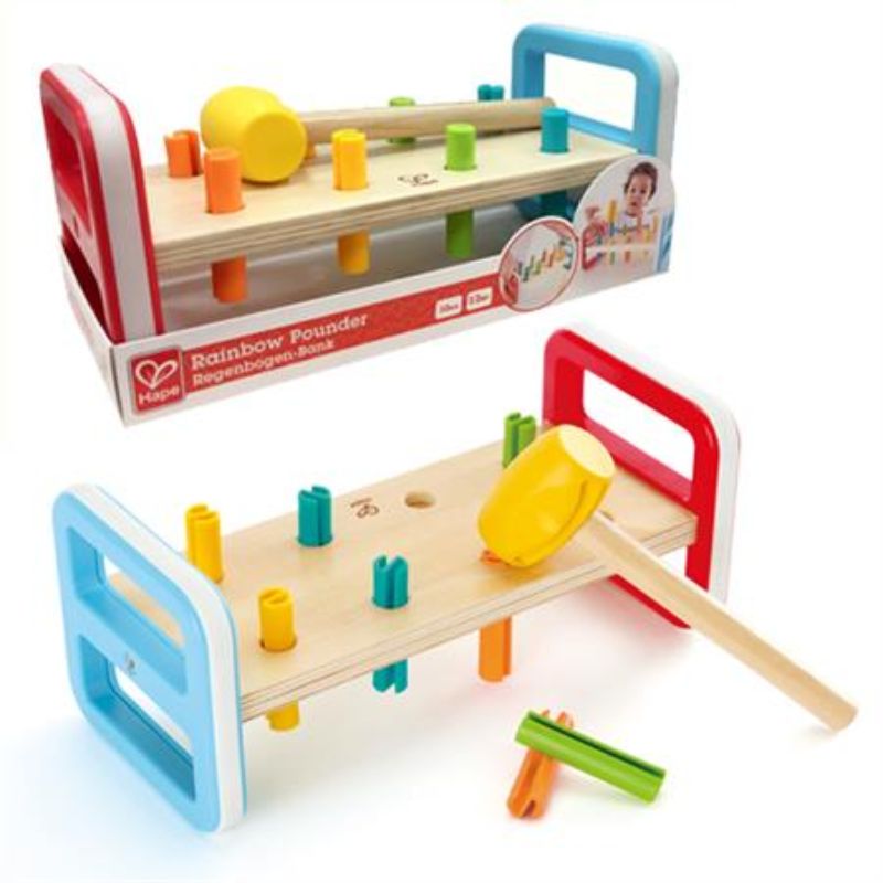 Colorful Hape Rainbow Pounder toy with pegs for hammering, enhancing fine motor skills and color recognition for toddlers.