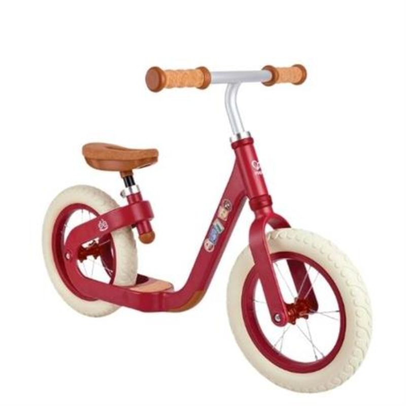 Lightweight red balance bike with adjustable saddle, cork handles, and puncture-proof tyres for kids aged 3 and up.