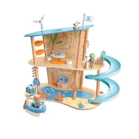 Colorful Ocean Rescue Beach House playset with eco-friendly animals, turtle figures, slide, and tools for ocean clean-up activities.