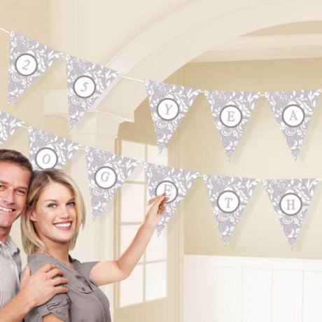 Silver pennant banner kit with 24 customizable flags, 120 letters, and 792cm ribbon for elegant event decor.