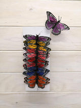 Assorted pack of 12 vibrant 9cm Monarch butterflies made of feathers, perfect for elegant decor and creative projects.