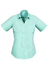 Advatex Ladies Lindsey Short Sleeve Shirt in Dynasty Green, featuring semi-fitted design, side splits, and inverted back pleat for comfort.
