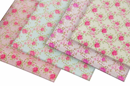 Elegant set of 4 glass rose coasters, featuring floral designs to protect surfaces and enhance your home decor.