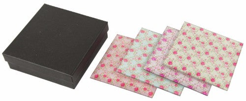Elegant set of 4 rose-patterned glass coasters, perfect for protecting surfaces while enhancing home decor.