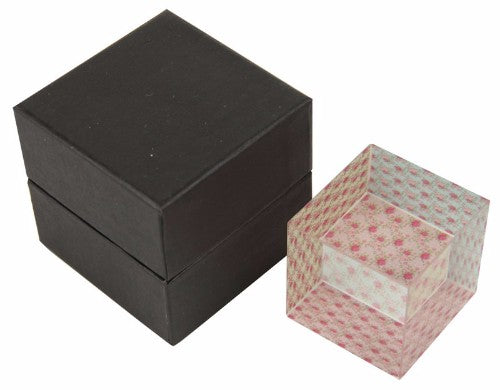 Elegant rose-themed glass paperweight, 6x6x5.9 cm, with intricate designs on three sides, perfect for home or office decor.