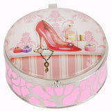 Stylish trinket box featuring handbag and shoe motifs, made of pewter with enamelled sides and a printed glass top.