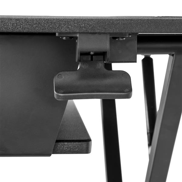 Sit-stand desk converter with a 900 mm work surface, featuring pneumatic height adjustments for ergonomic workspace flexibility.