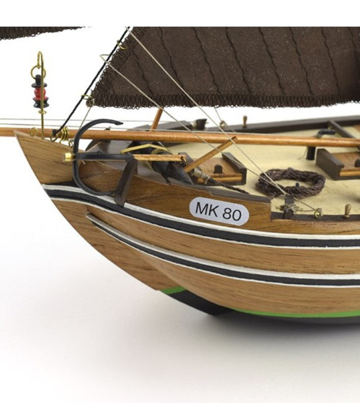 1/35 scale model kit of the Dutch fishing boat Botter with laser-cut parts, hand-sewn sails, and a wooden display base.