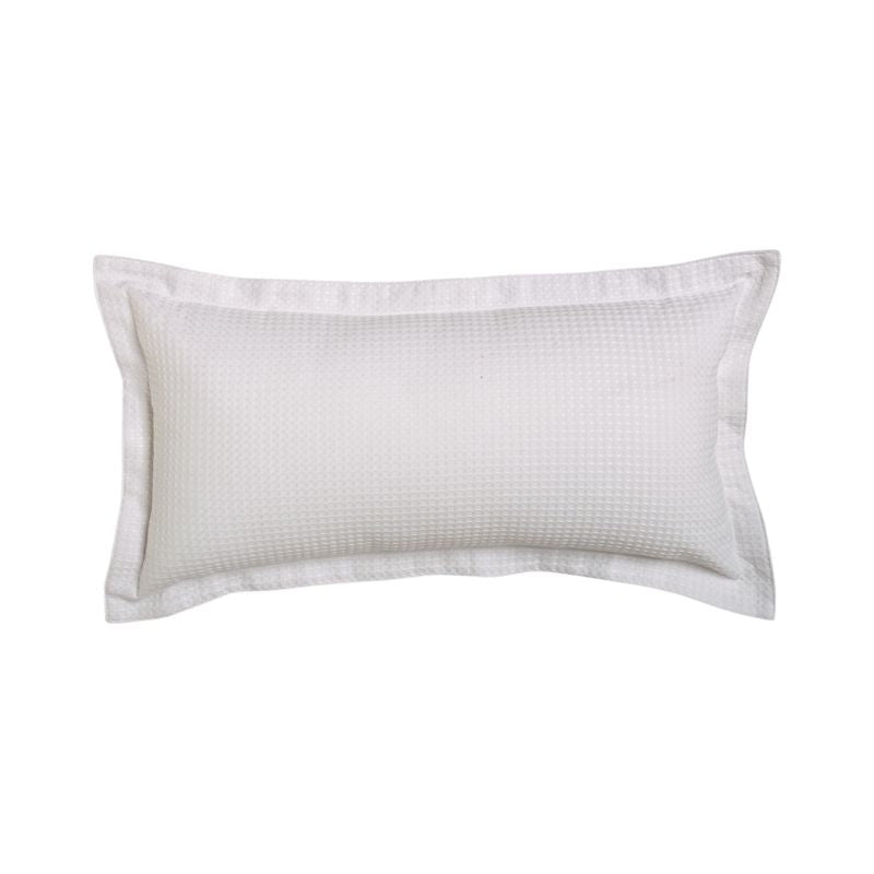 Long white cushion with textured waffle weave and tailored edges for elegant home decor enhancement.