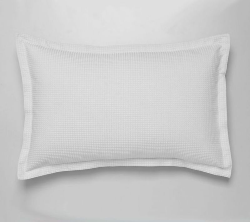 Standard white pillowcase pair by Logan & Mason, crafted from soft polyester-cotton blend for elegance and durability.