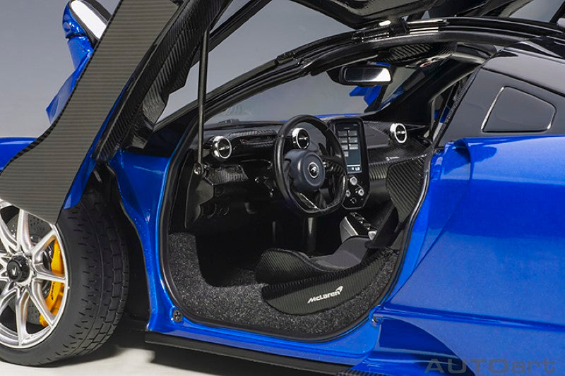 Detailed 1/18 diecast model of McLaren Senna in striking blue, showcasing realistic design and fine interior craftsmanship.
