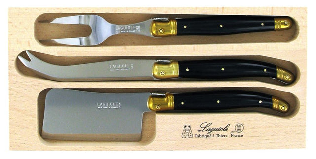 Elegant three-piece cheese set with stainless steel blades, resin handles, and brass bolsters, packaged in a wooden tray.