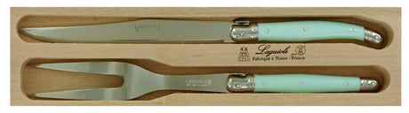 Pale green Verdier carving set with stainless steel knife and fork, featuring ergonomic resin handles and Laguiole bee.