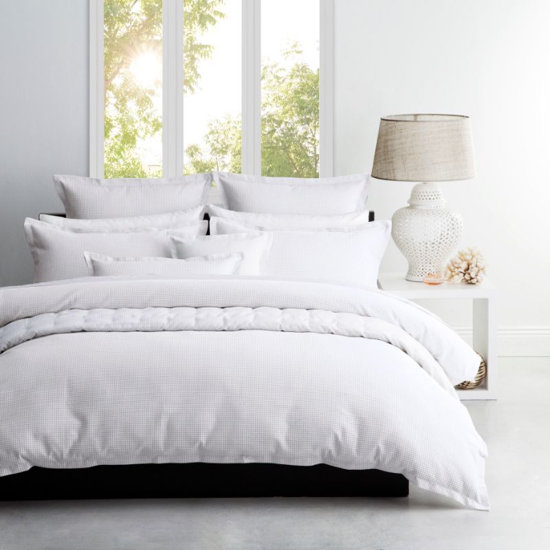 Elegant Ascot White double duvet cover set with textured waffle weave and self-flange, perfect for a serene bedroom retreat.