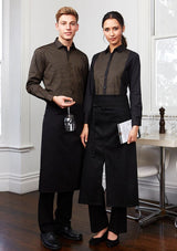 Full-length black apron with fold-over waist, towel loop, and front pocket for pens and bottle opener; ideal for chefs and home cooks.