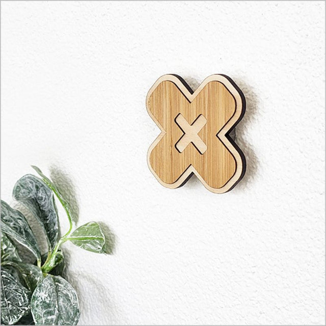 Elegant bamboo wall hook in cross design, 6.5cm, eco-friendly, perfect for organizing clothing, towels, and bags.