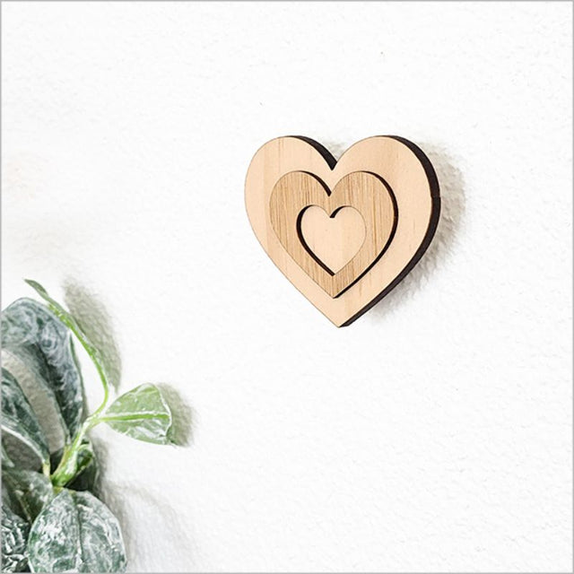 Heart-shaped bamboo wall hook, 6.5cm, eco-friendly, FSC certified, perfect for kids' rooms or entryways.