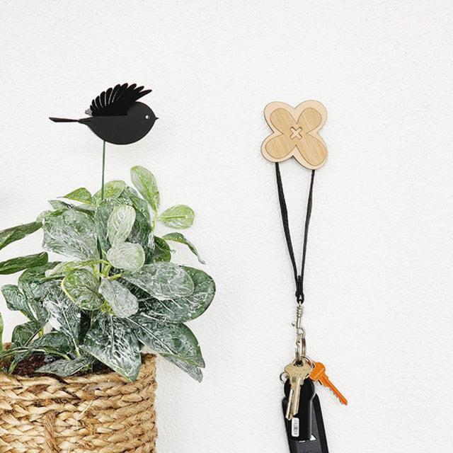 Eco-friendly bamboo hook featuring a wildflower design, ideal for organizing clothing, towels, and bags in any space.